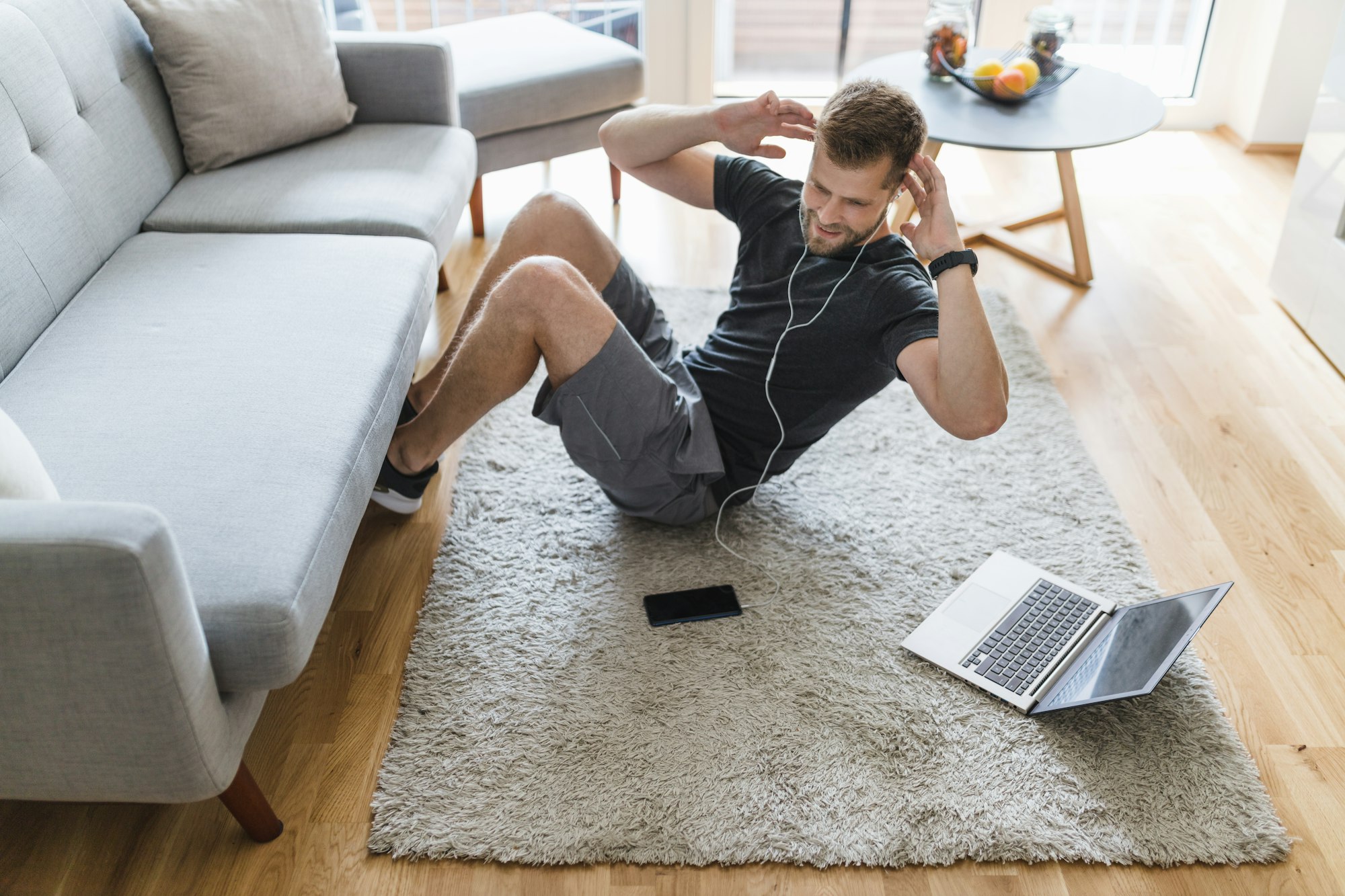 Handsome man working out at home